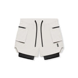 flatlay Tetra-Lite Liner Cargo Shorts in stone with black accents, top view