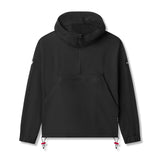 Flatlay of black Weather-Ready Anorak Jacket with red drawstring accents, front view