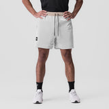SilverPlus™ Mesh Reversible Short in beige, modeled front view on male wearer
