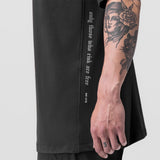 Supima® Mesh Panel Oversized Tee in Dusk Black, worn by model showing side view with arm visible