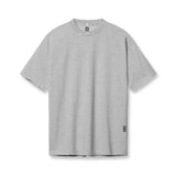 flatlay Tech Essential Relaxed Tee in heather grey, front view