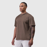 Tech Essential Relaxed Tee in Faded Dark Earth, worn by model in side profile view