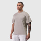 Tech Essential Relaxed Tee in Faded Chai, modeled from side angle