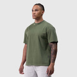 Tech Essential Relaxed Tee in faded olive worn by model, front view