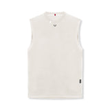 Flatlay of Tech Essential Relaxed Cutoff sleeveless tank in stone, front view