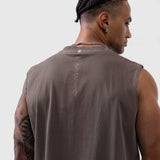 Tech Essential Relaxed Cutoff tank in faded dark earth, worn by model showing back view
