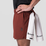 0810. Ultralite™ 6" Linerless Short in Brick, worn with white towel, side view