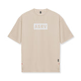 Flatlay of ASRV AeroSilver Oversized Tee in beige with box logo, front view