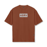 Flatlay of ASRV AeroSilver oversized tee in brick with gray box logo, front view