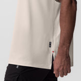 AeroSilver Oversized Tee in beige worn by model, side view showing box logo detail