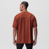 AeroSilver Oversized Tee in brick red, worn by model, back view
