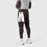 Tetra-Lite Cargo High Rib Jogger in Dark Earth, back view on model