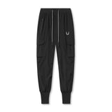 flatlay Tetra-Lite® Cargo High Rib Jogger in black with reflective details, front view