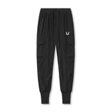 Flatlay of black Tetra-Lite Cargo High Rib Jogger with white wings logo, front view