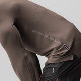 3D-Lite® 2.0 Fitted Long Sleeve in deep taupe worn with black joggers, detail of back text