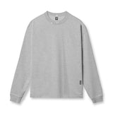 flatlay Tech Essential Relaxed Long Sleeve in heather grey, front view