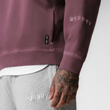 Tech Essential Distressed Crewneck in Faded Crimson worn by model, close-up detail view