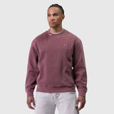 Tech Essential Distressed Crewneck in faded crimson, worn by model with grey sweatpants