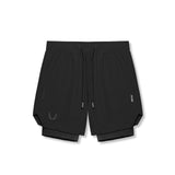 Flatlay of Tetra-Lite 7" Liner Short in black with black wings logo, front view