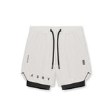 Flatlay of ASRV Tetra-Lite 7" Liner Shorts in stone and black, front view