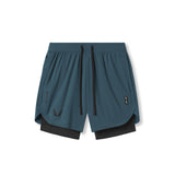 Flatlay of Tetra-Lite 7" Liner Shorts in Storm blue and black, front view