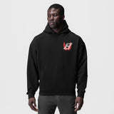 Tech-Terry Zip Pocket Hoodie in black with red logo, worn by model, front view