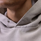 Tech Essential Distressed Hoodie in Faded Chai worn by model, close-up detail shot