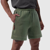 Tech Essential Sweat Short in Faded Olive worn by model, side view