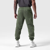 Tech Essential Sweats in faded olive worn by model, back view