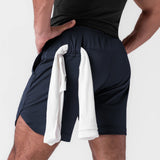 AeroSilver 7" Linerless Short in navy, worn by model with towel draped over shoulder, back view