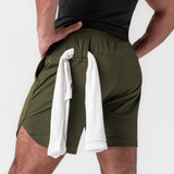 AeroSilver 7" linerless short in olive worn by model, back view with towel