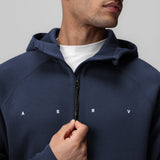 Dri-Core™ Zip Hoodie in navy worn by model, front view with hand on zipper