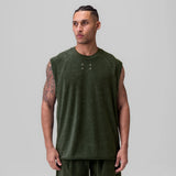 Towel Terry Cutoff sleeveless tank in olive, worn by model facing forward