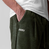 Towel Terry Relaxed Short in olive worn by model with hand in pocket, showing fit and fabric