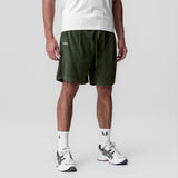 Towel Terry Relaxed Short in olive worn by model with white tee and white sneakers, front view
