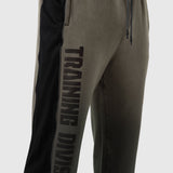 Tech-Terry Mesh Panel Sweats in olive with black mesh panels, worn by model, side view
