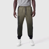 Tech-Terry Mesh Panel Sweats in olive with black panels, worn by model, front view