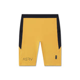 flatlay Lycra® Ribbed Run Half-Tight shorts in amber and black, front view