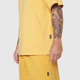 Supima Ice-Skin Reversible Tee in amber yellow worn by model, side view