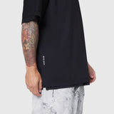 Black Supima Ice-Skin reversible tee on model with tattooed arm, side view