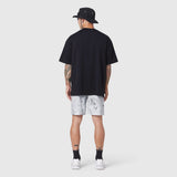 Black SUPIMA® Ice-Skin™ Reversible Tee worn with light tie-dye shorts, back view