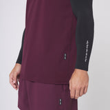 Warpflexx-Lite Training Tank in merlot worn with black long sleeve, side view