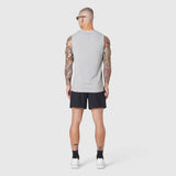Warpflexx-Lite Training Tank in slate grey, worn by model from back, paired with black shorts