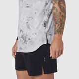 Aerotex™ Perforated Run Tank in Sedona Snow Camo worn with black shorts, side view