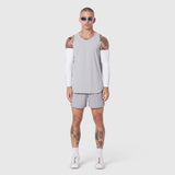 Aerotex Perforated Run Tank in slate grey, worn with matching shorts and white arm sleeves