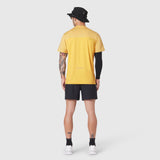 AEROSILVER® UPF50+ Run Tee in amber yellow worn by model from back, paired with black shorts