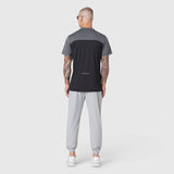 AEROSILVER UPF50+ Run Tee in black and gray colorblock, back view on model