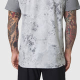 AEROSILVER® UPF50+ Run Tee in Sedona Snow Camo worn by model showing back view with tattooed arms
