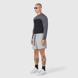 Revolutional Training Short in Slate Grey worn with colorblock long-sleeve top, side view