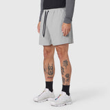 Revolutional Training Short in slate grey worn by model, side view
